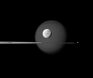 Four Moons - In, Through, and Beyond Saturn's Rings.